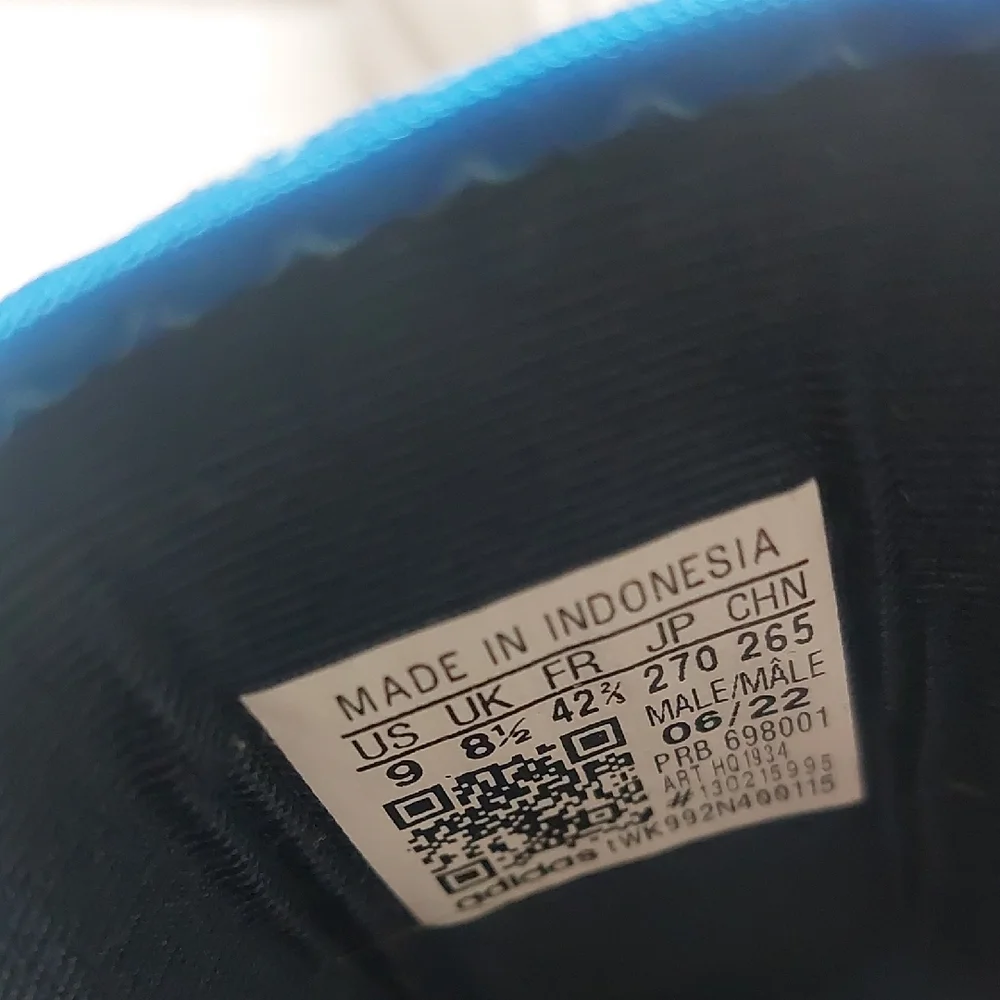 Adidas Adifom SLTN shoes in the Cloud White / SolarYellow / Blue Colorway